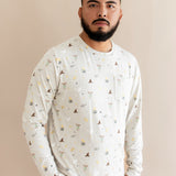 Person wearing a cream Men's jogger set with Harry Potter prints on a beige background