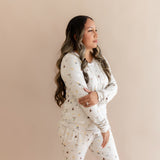 Model looking to the side while wearing the Women's Jogger Pajama Set in Starry Icon 