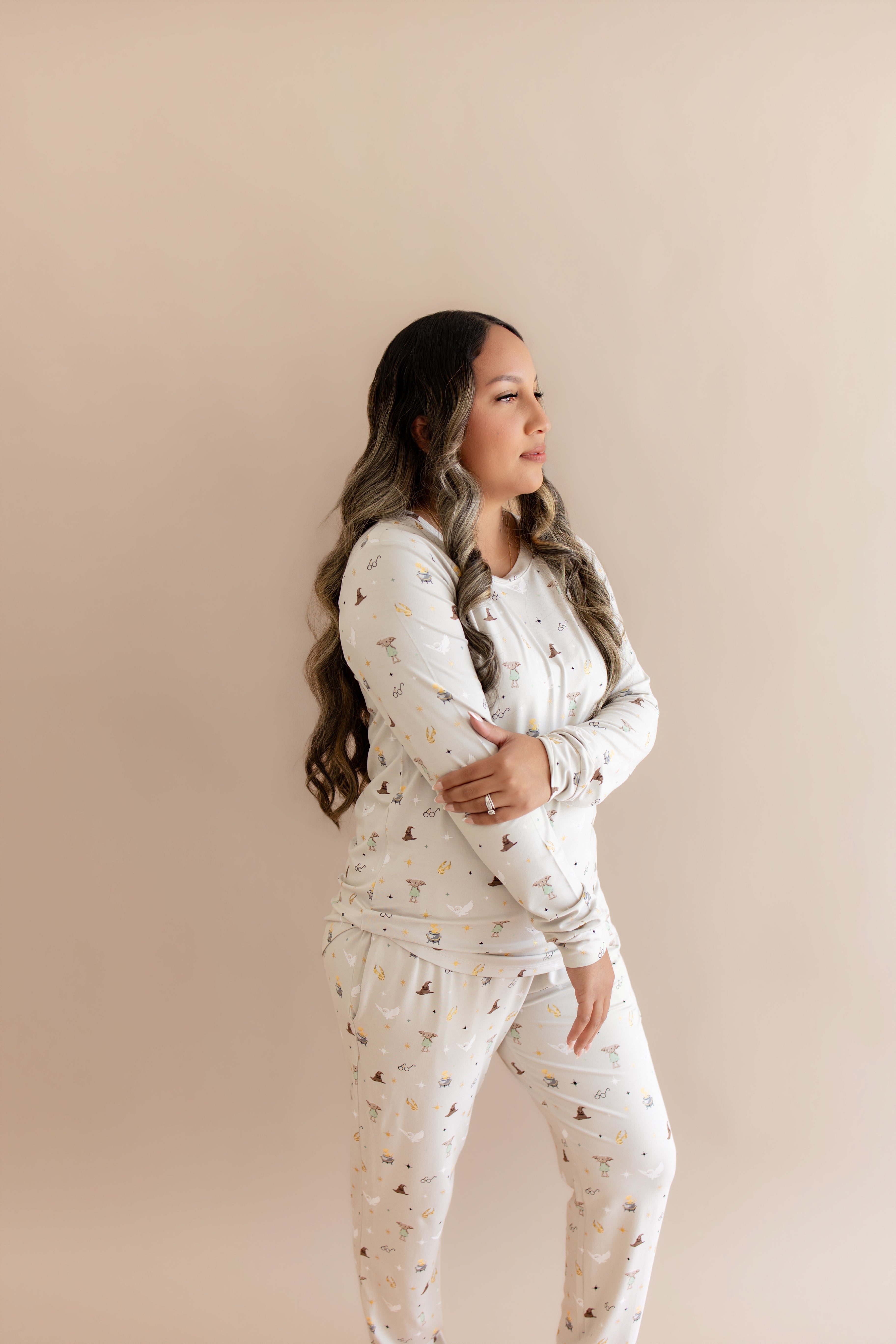 Model looking to the side while wearing the Women's Jogger Pajama Set in Starry Icon 