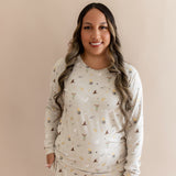 Women wearing a beige Harry Potter patterned joggers set on a beige background