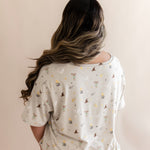 Back side of Women's Relaxed Fit V-Neck in Starry Icon while on a model 