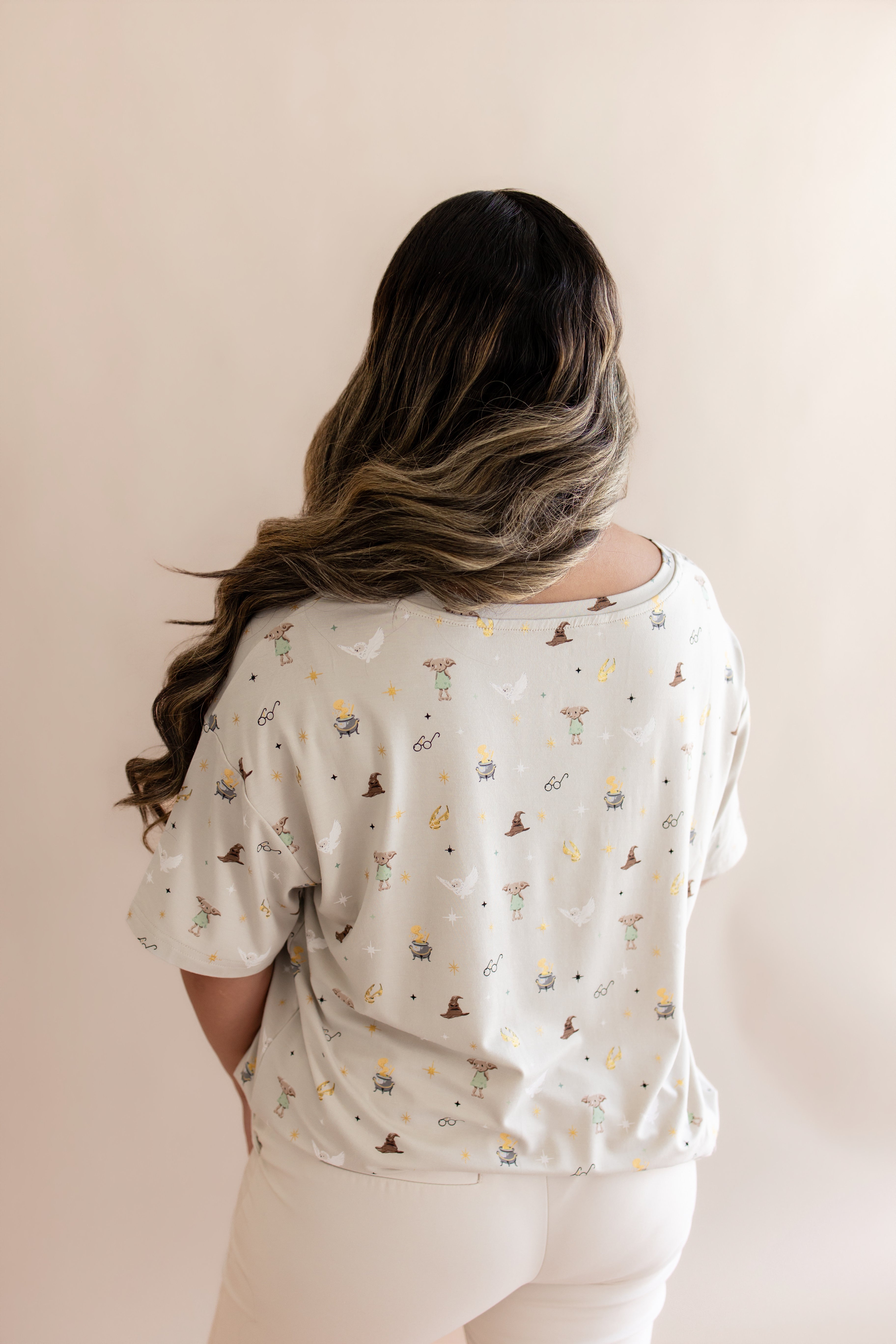 Back side of Women's Relaxed Fit V-Neck in Starry Icon while on a model 