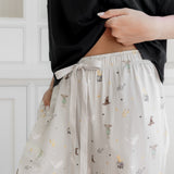 Women's cream lounge pant with Harry Potter pattern on it with drawstring.