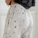 Back side of a cream Harry Potter patterned women's lounge pant with pockets.