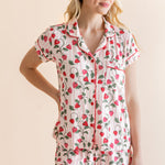 Blonde woman standing infront of a beige background while modeling the Women's Short Sleeve Pajama Set in Strawberry Fields

::: Model is 5'9" wearing size S ///