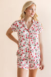 Blonde woman standing infront of a beige background while modeling the Women's Short Sleeve Pajama Set in Strawberry Fields

::: Model is 5'9" wearing size S ///