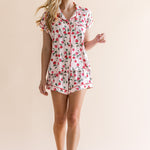 Smiling model looking to the side while wearing the Women's Short Sleeve Pajama Set in Strawberry Fields
