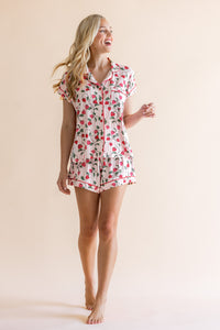 Smiling model looking to the side while wearing the Women's Short Sleeve Pajama Set in Strawberry Fields
