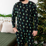 Model with hand in pocket while wearing the Kyte Men's Jogger Set in Twinkle Trees 
