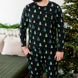 Model with hand in pocket while wearing the Kyte Men's Jogger Set in Twinkle Trees 