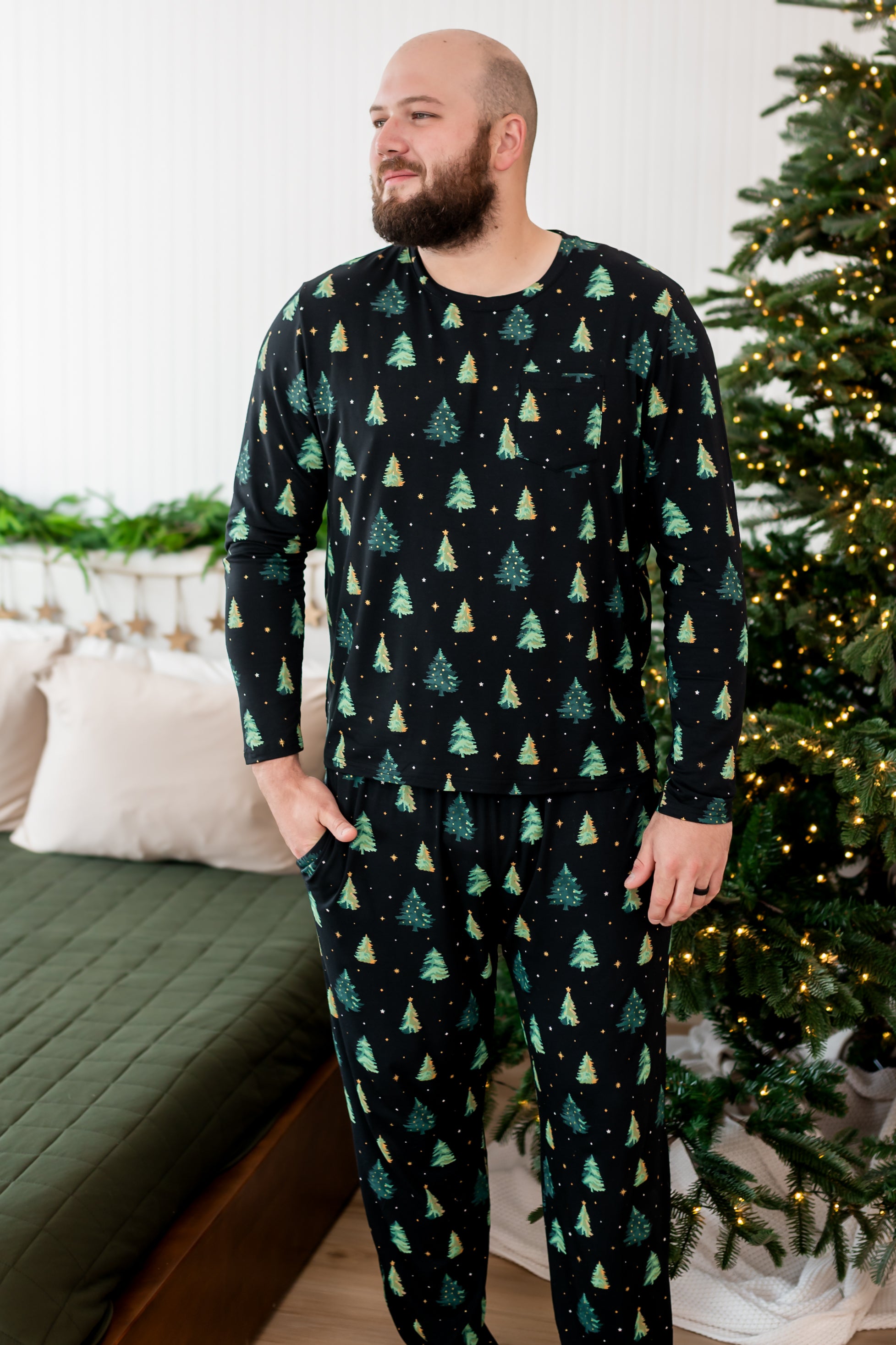 Model with hand in pocket while wearing the Kyte Men's Jogger Set in Twinkle Trees 