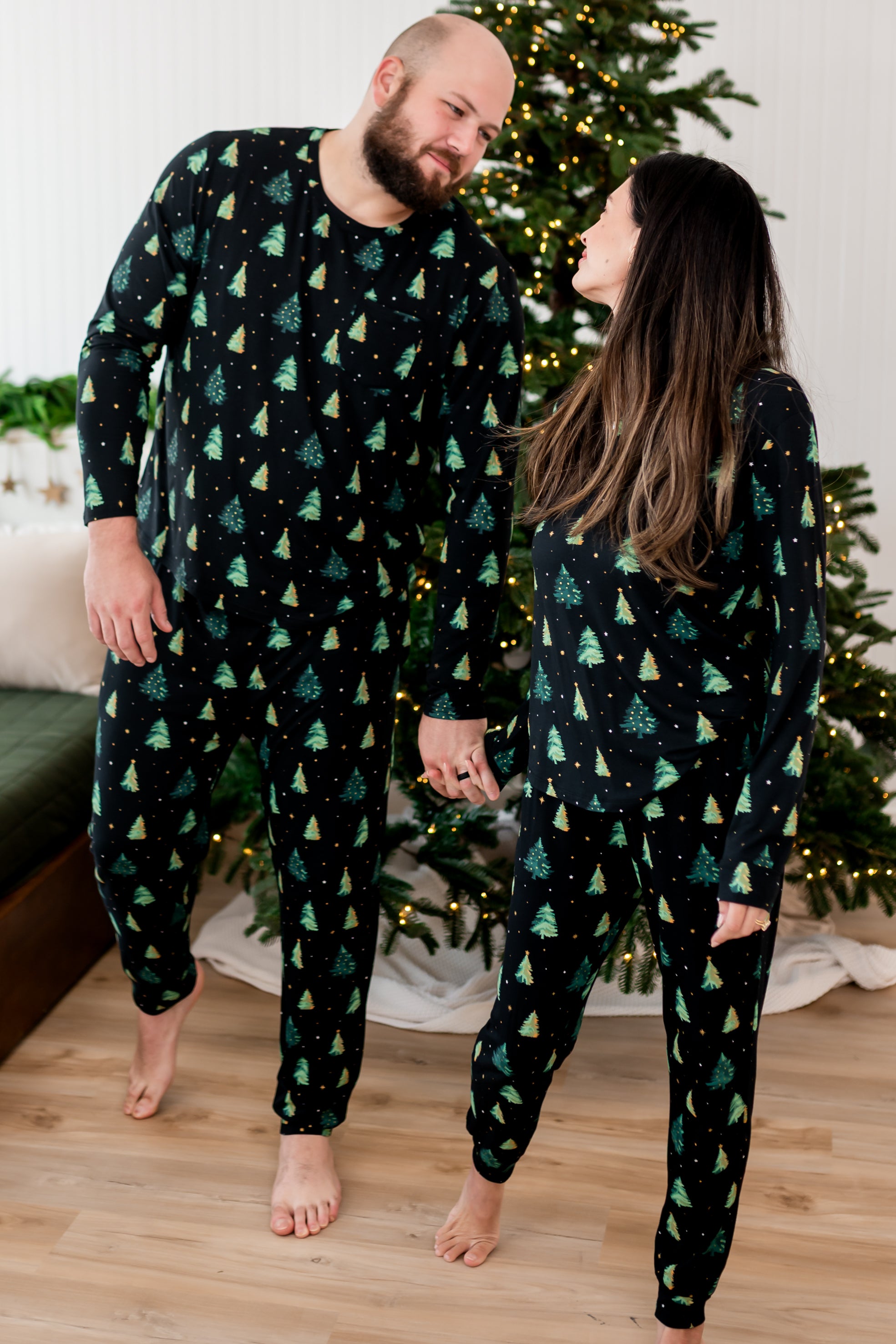 Male and female models wearing matching  Jogger Pajama Sets in Twinkle Tree