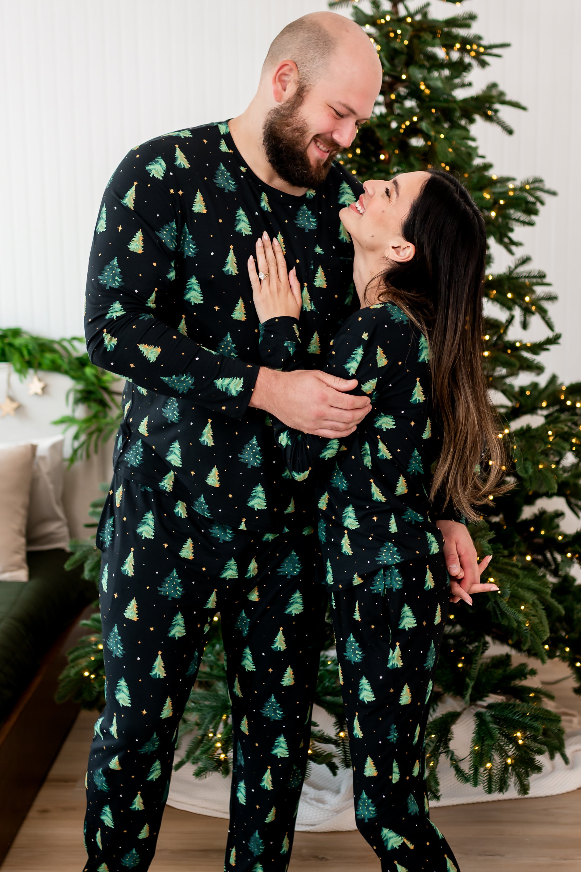 Woman and men holding each other in matching  Jogger Set in Twinkle Trees 