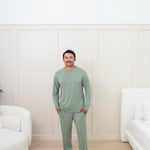 Man modeling Men's Lounge Pants in Thyme with matching henley tee