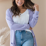 Female modeling the Bamboo Jersey Adult Cardigan in Taro wearing a white shirt and light wash jeans