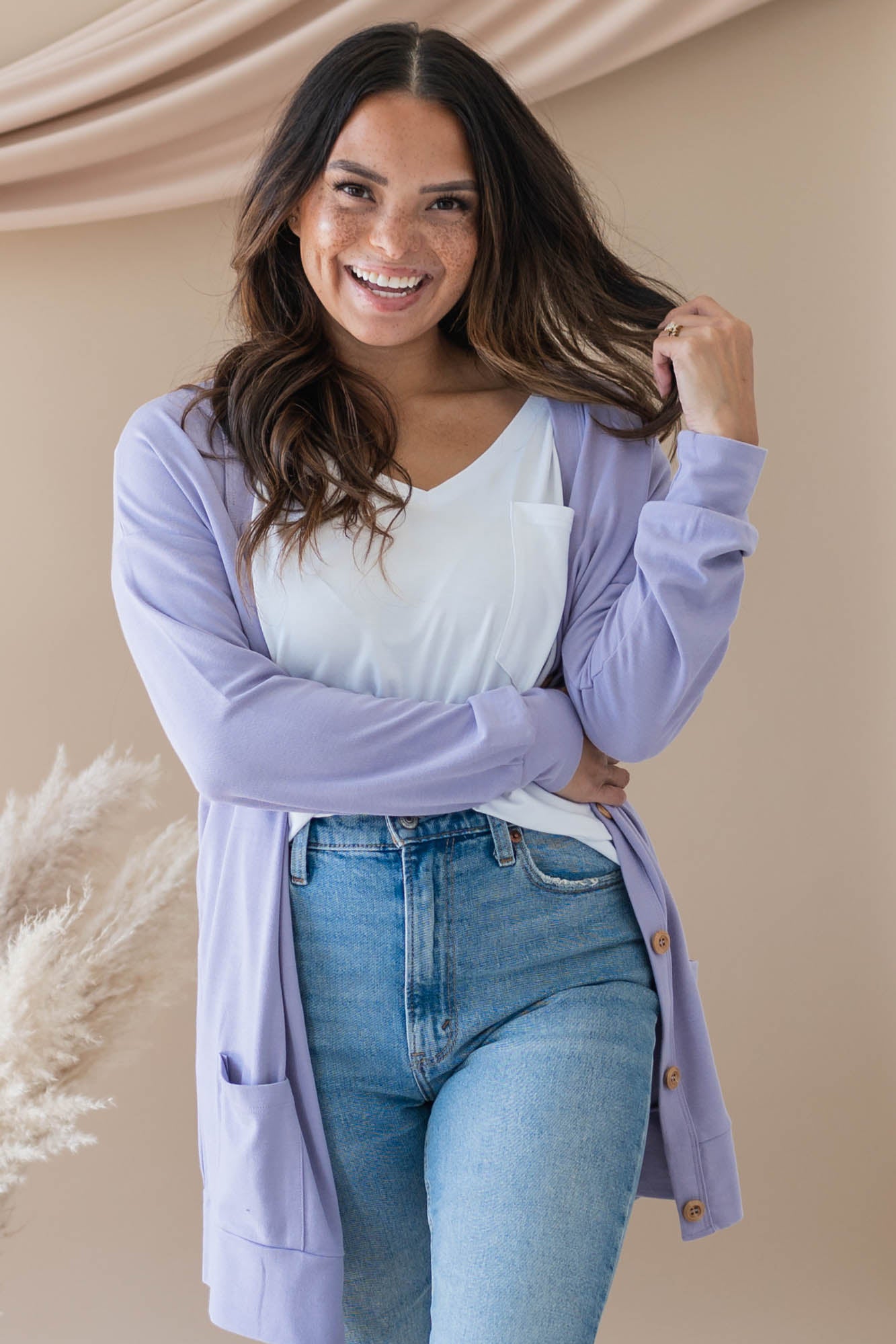 Female modeling the Bamboo Jersey Adult Cardigan in Taro wearing a white shirt and light wash jeans
