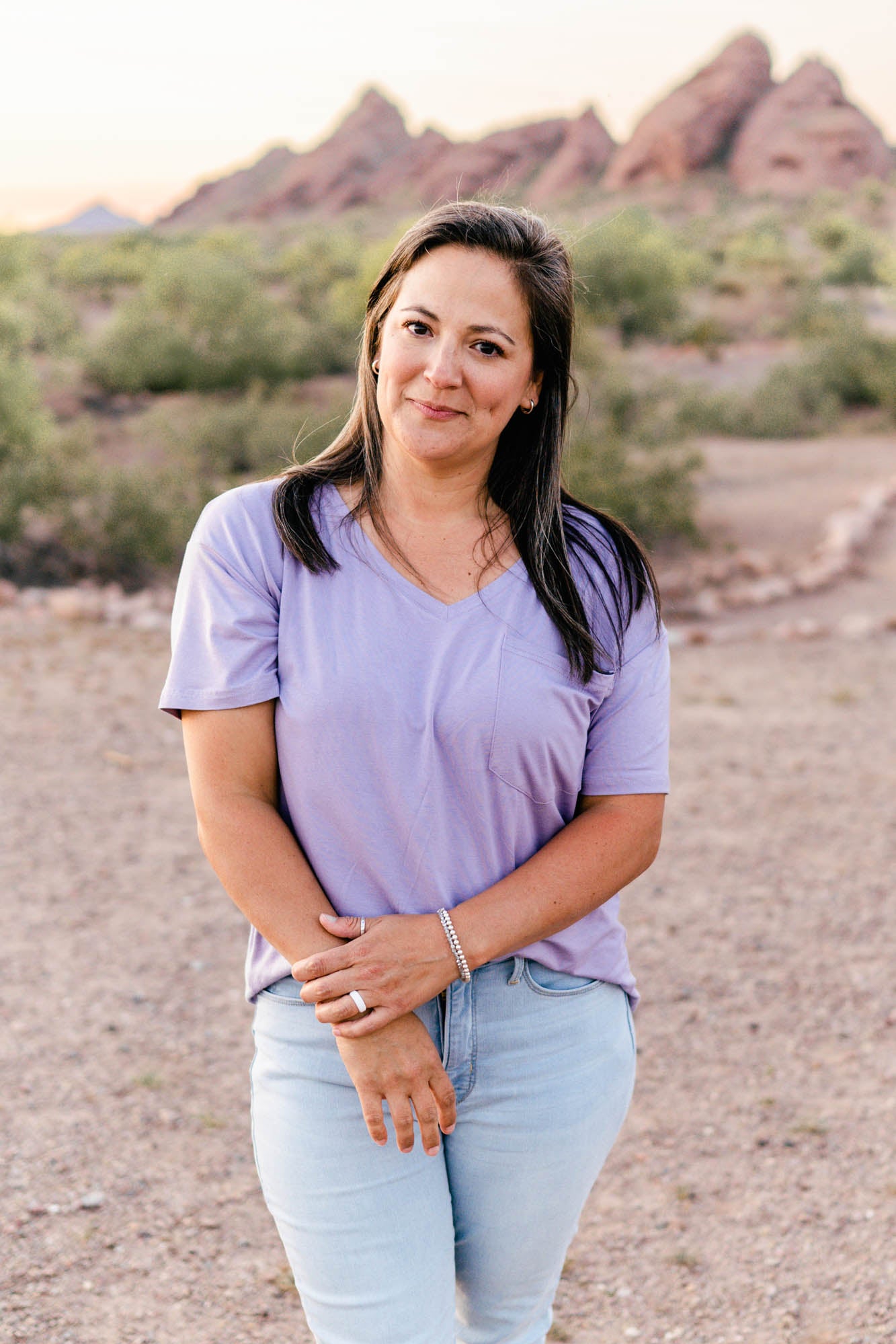Female wearing the Women’s Relaxed Fit V-Neck in Taro paired with a light wash jean