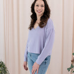 Model wearing the Women's Ribbed Long Sleeve Crop Top in Taro 