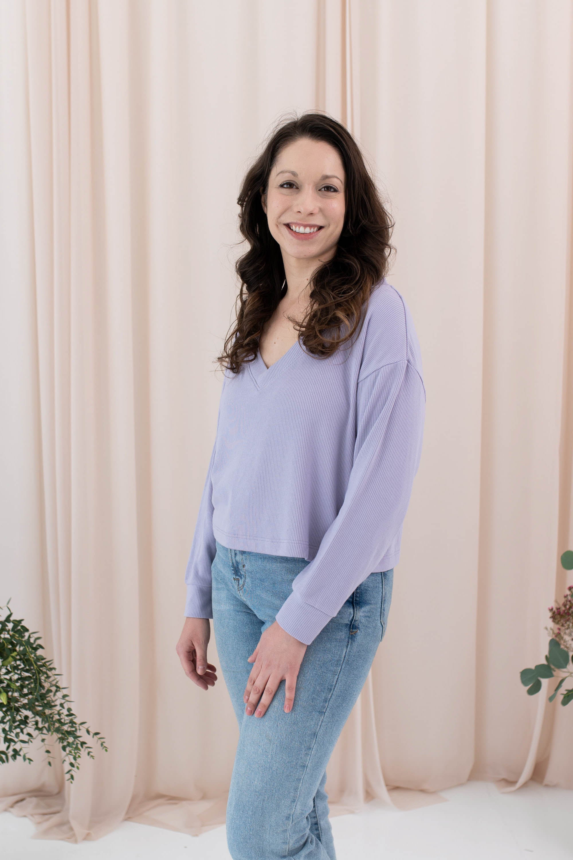 Model wearing the Women's Ribbed Long Sleeve Crop Top in Taro 