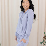 Female model in the Women's Ribbed Hoodie in Taro paired with Taro Jogger Pants