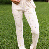 Close up of model wearing the Women's Lounge Pants in Tennis while barefoot in the grass

::: Model is 5'6" wearing size XS ///