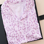 Women's Short Sleeve Pajama Set in Thistle Leopard print packed in a box on a beige background