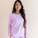 Model wearing Women's Jogger pajama set in Thistle Leopard print on a beige background
