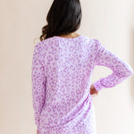 Back side of Women's Jogger pajama set in Thistle Leopard print on a beige background