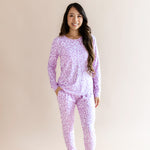 Model wearing Women's Jogger pajama set in Thistle Leopard print on a beige background ::: Model is 5'3" wearing size S ///
