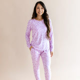 Model wearing Women's Jogger pajama set in Thistle Leopard print on a beige background ::: Model is 5'3" wearing size S ///