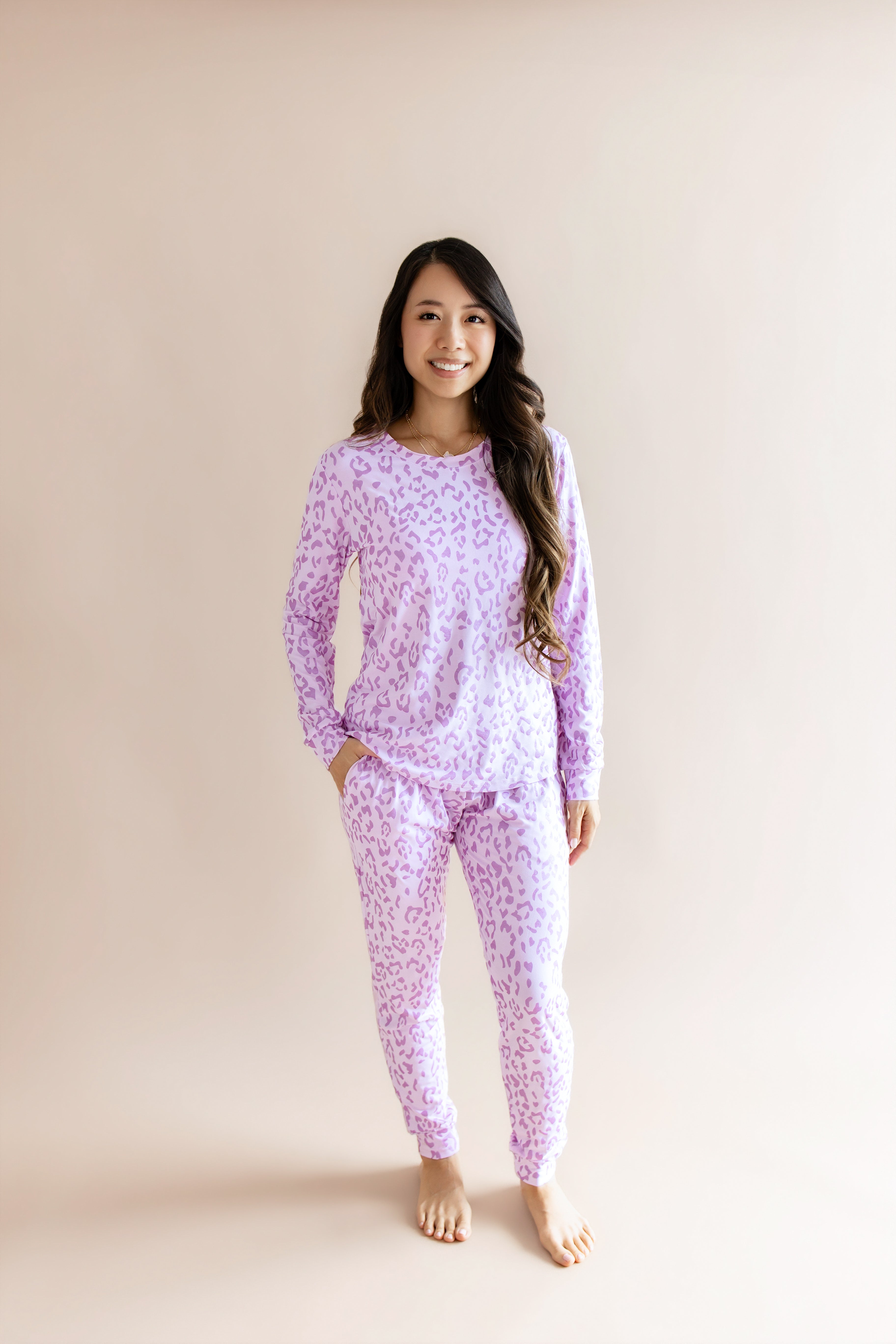 Model wearing Women's Jogger pajama set in Thistle Leopard print on a beige background ::: Model is 5'3" wearing size S ///