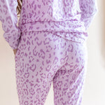 Back side of Women's Jogger pajama set pant in Thistle Leopard print on a beige background