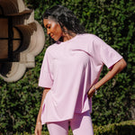 Model standing in front of greenery while wearing the Kyte Bamboo Women’s Biker Short Set in Thistle ::: Model is 5'9" wearing size S ///