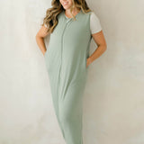 Smiling model wearing the Adult Sleep Bag Walker in Thyme