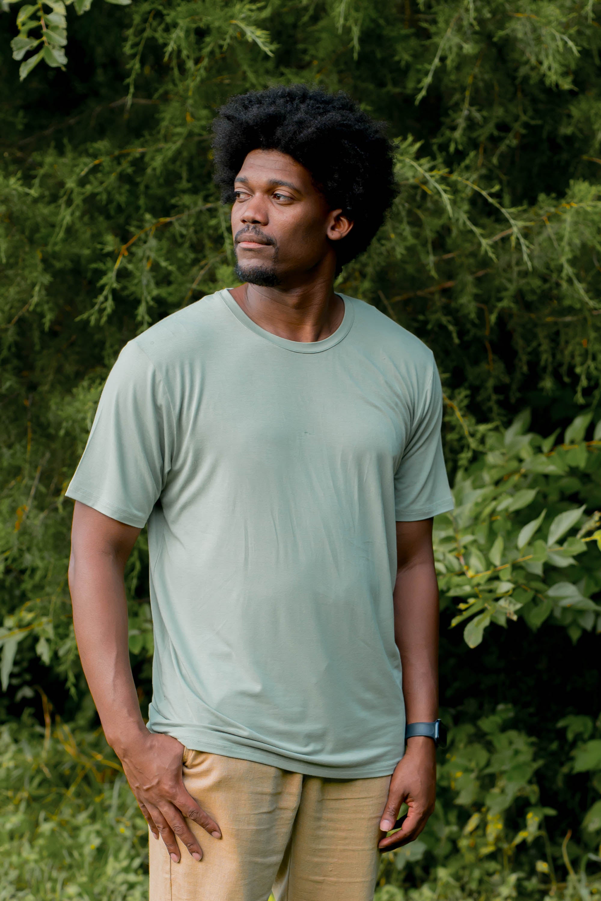 Male model wearing the Men's Crew Neck Tee in Thyme 