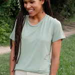 Female model wearing the Women's Crew Neck Tee in Thyme