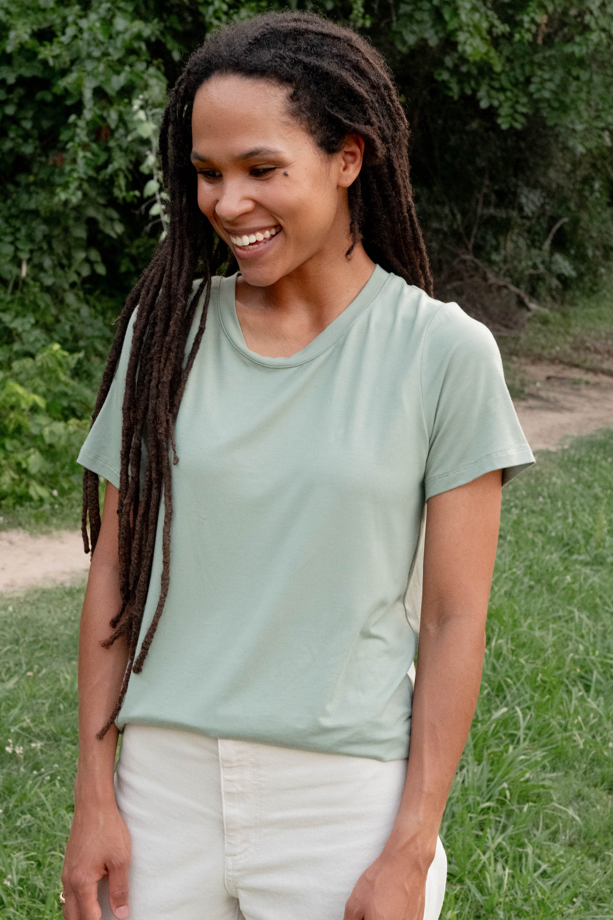 Female model wearing the Women's Crew Neck Tee in Thyme