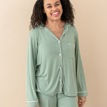 Model wearing Kyte Baby's Women's Long Sleeve Pajama Set in Thyme with Cloud Trim