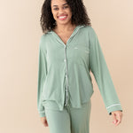 Smiling model wearing Women's Long Sleeve Pajama Set in Thyme with Cloud Trim