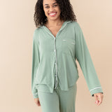 Smiling model wearing Women's Long Sleeve Pajama Set in Thyme with Cloud Trim