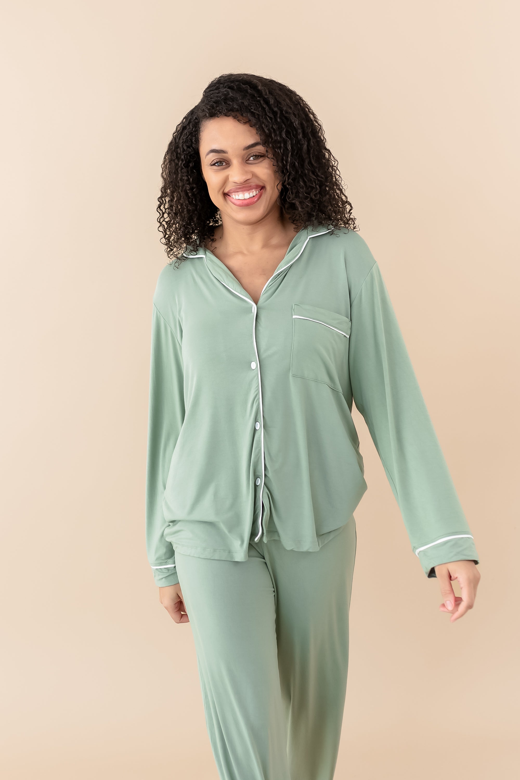 Smiling model wearing Women's Long Sleeve Pajama Set in Thyme with Cloud Trim