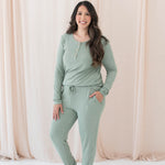 Model wearing the Women's Ribbed Henley Top in Thyme