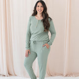 Model wearing the Women's Ribbed Henley Top in Thyme