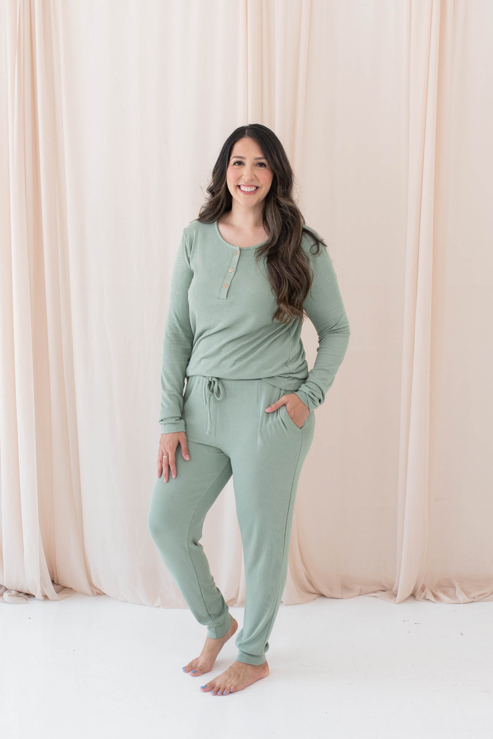 Model wearing the Women's Ribbed Henley Top in Thyme