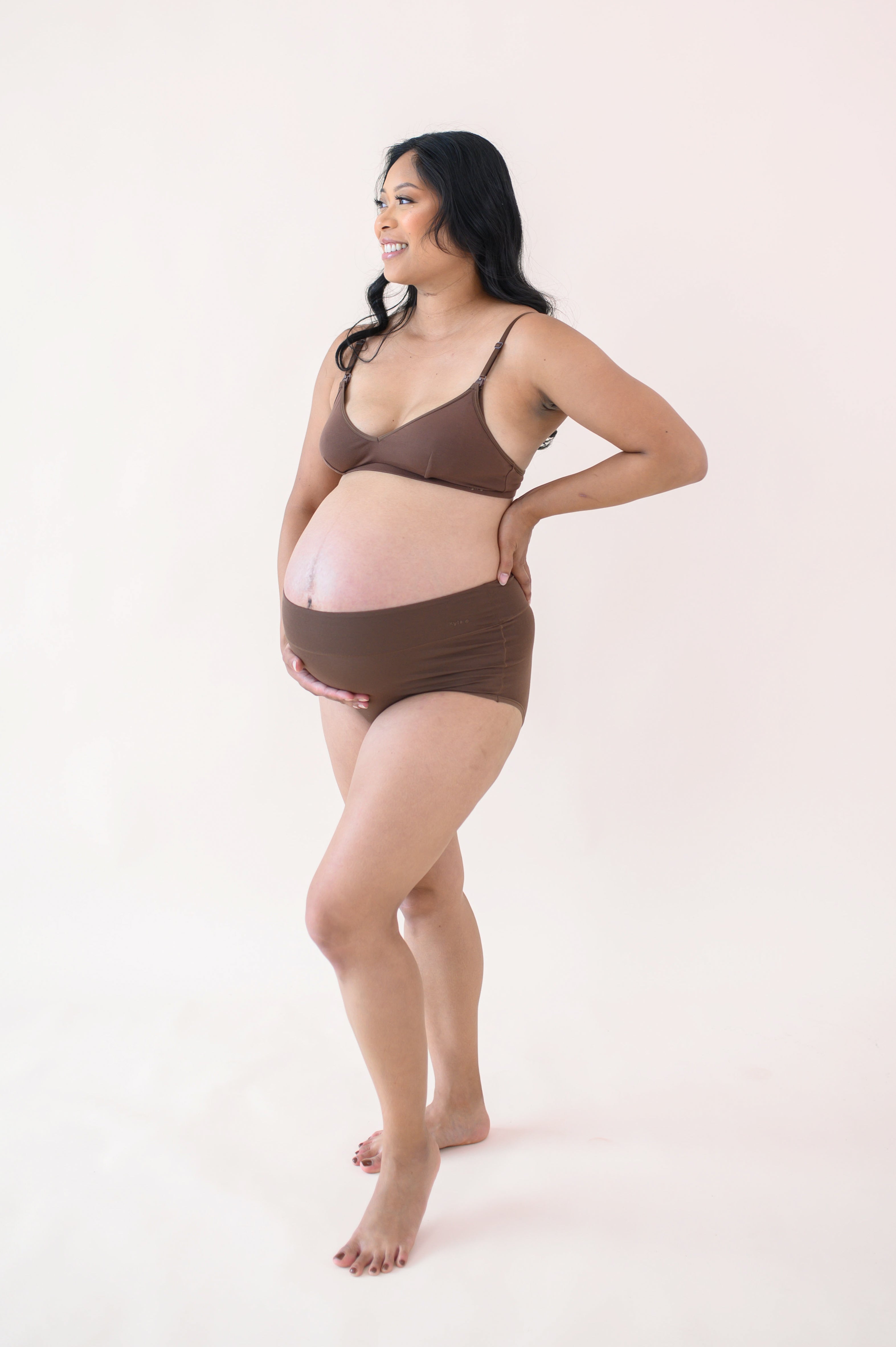 Woman modeling Women's High-Waisted Brief in Toffee and nursing bra