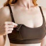 Model show casing the open clasp on the Women's Pumping Bra in Toffee 