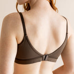 Model show casing the back side and straps on the Women's Pumping Bra in Toffee