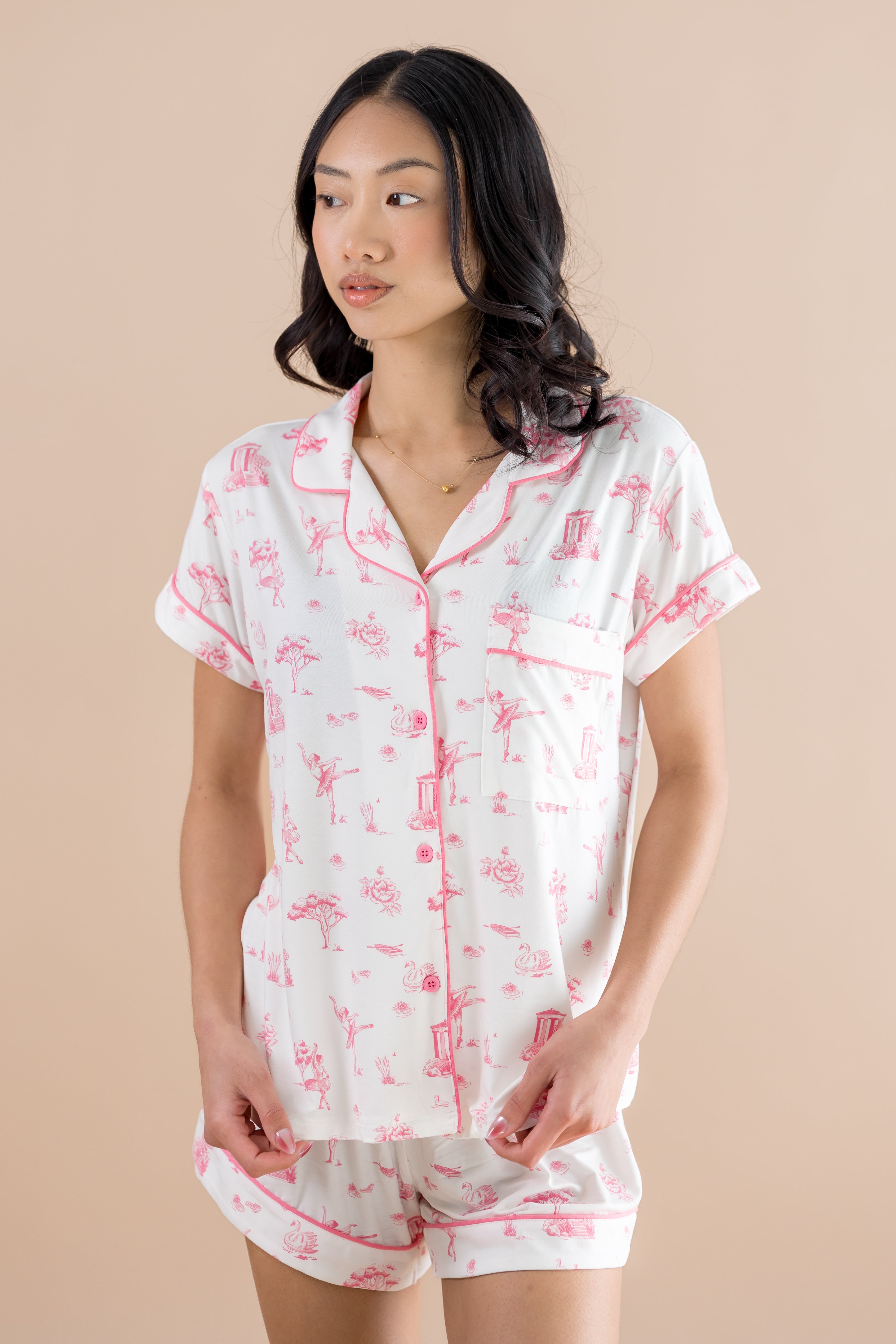 Woman looking to the side while modeling the Bamboo Women's Short Sleeve Pajama Set in Toile Ballet