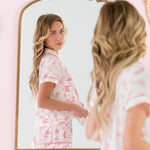 Reflection of a woman looking backwards into a mirror while wearing the  Bamboo Women's Short Sleeve Pajama Set in Toile Ballet 
