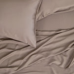 Close up of the Bamboo Sateen Sheet Set in Truffle shown on a bed